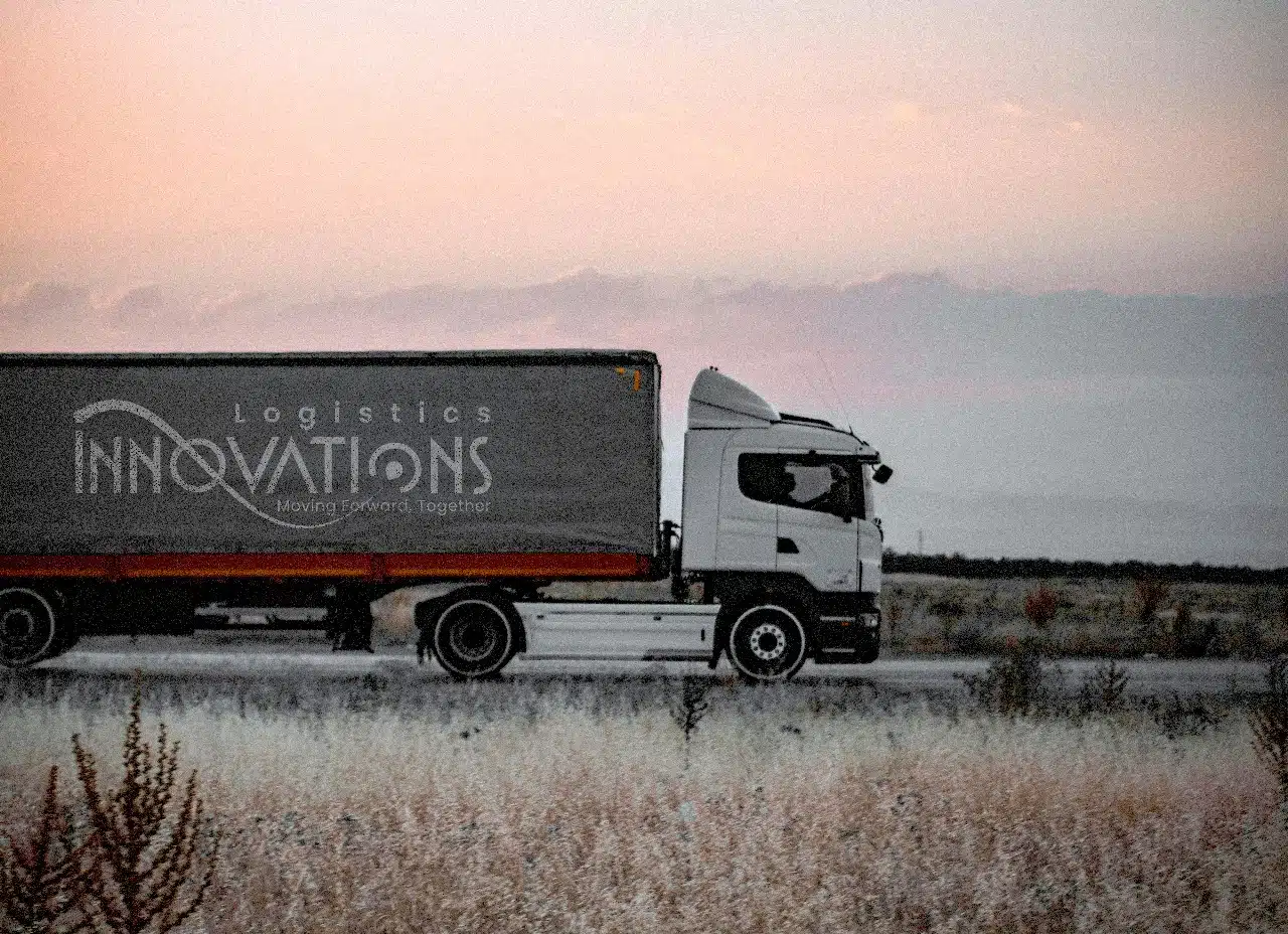 Innovations Logistics truck driving at sunset providing freight and transport services